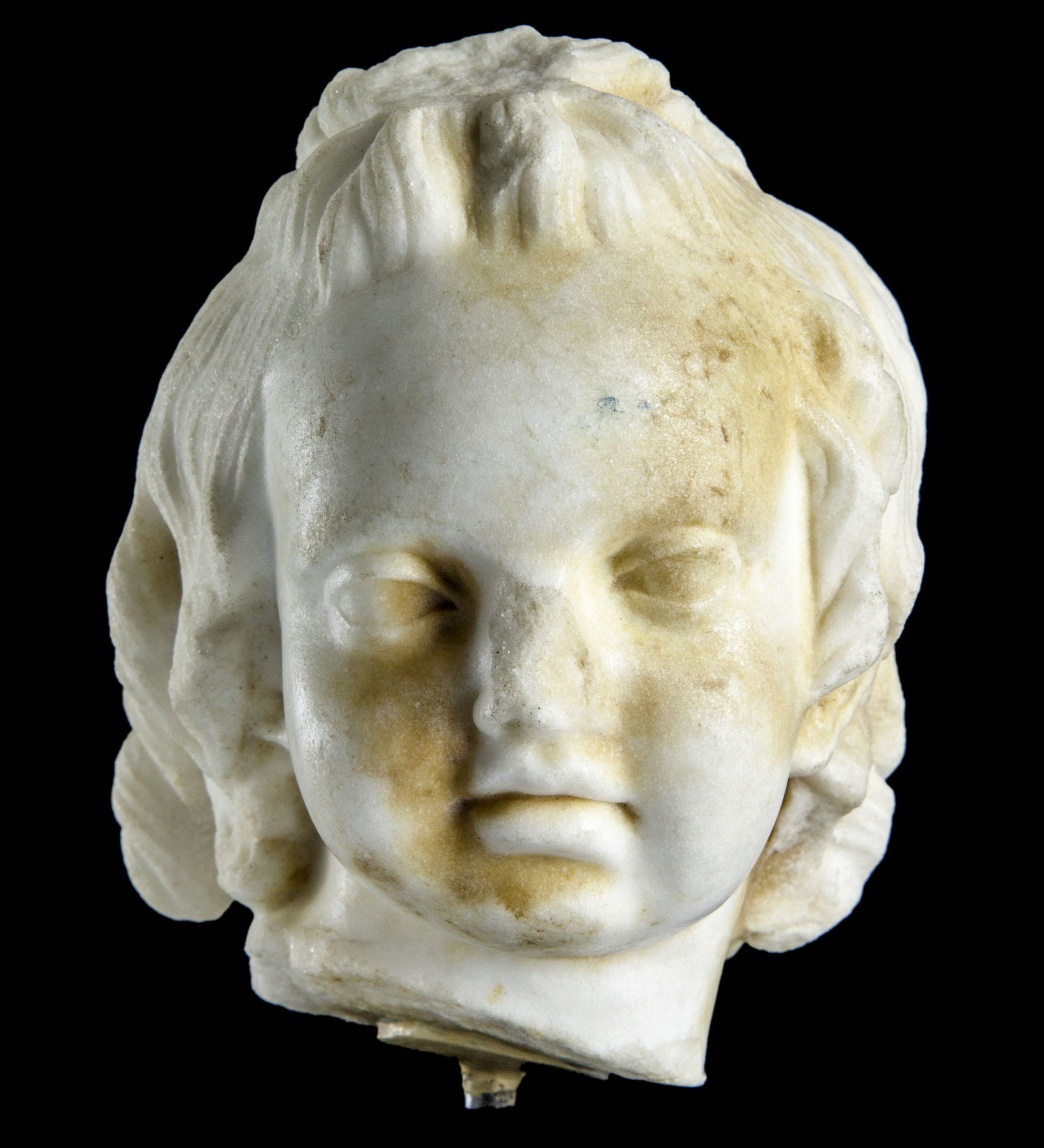 Tête d’enfant en marbre (Amor) © Site et Musée romains d'Avenches, photo NVP3D